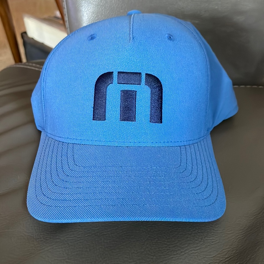 Travis Mathew light blue flex fit hat. Never worn.
